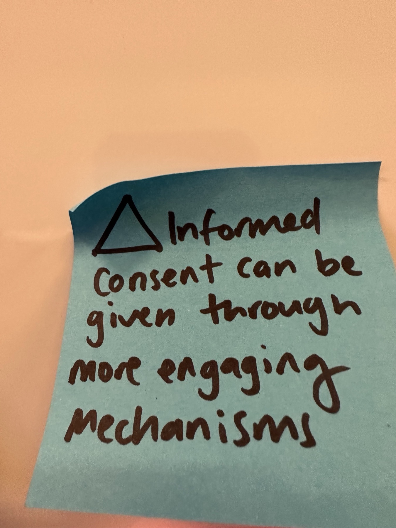 A handwritten workshop note reading: informed consent can be given through more engaging mechanisms
