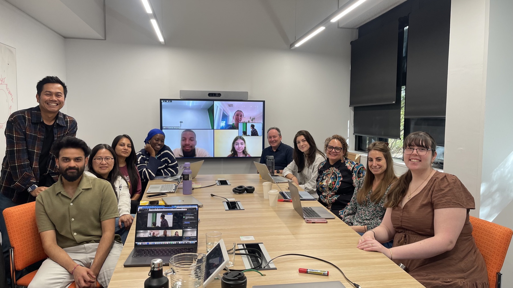 A hybrid team workshop connecting practitioners in the room and online